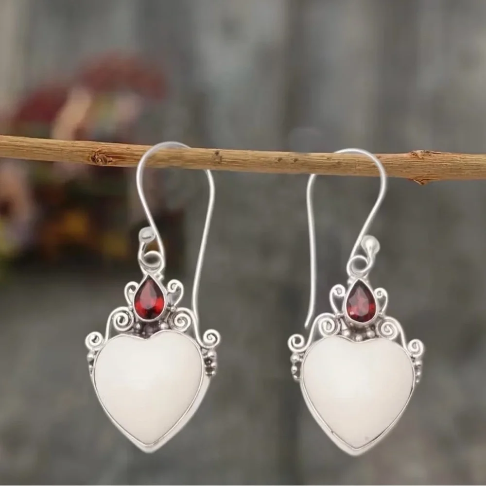 Elegant Silver and White Heart Earrings with Red Gemstones